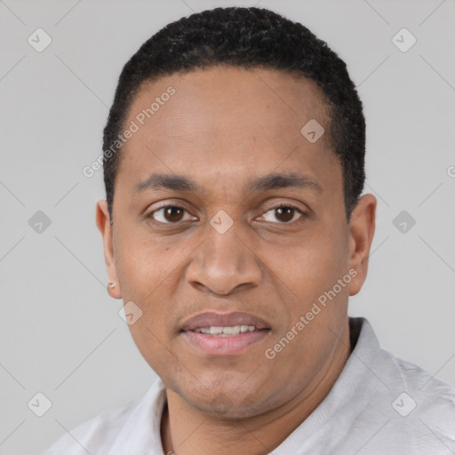 Joyful latino adult male with short  black hair and brown eyes