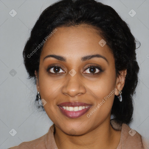 Joyful black young-adult female with long  black hair and brown eyes