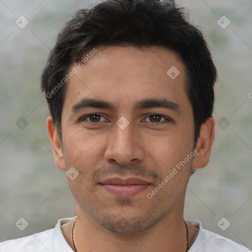 Joyful white young-adult male with short  black hair and brown eyes