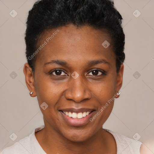 Joyful black young-adult female with short  brown hair and brown eyes