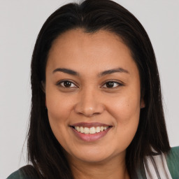 Joyful asian young-adult female with long  brown hair and brown eyes