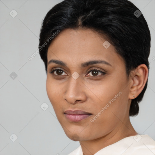 Joyful latino young-adult female with short  brown hair and brown eyes