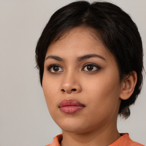Neutral latino young-adult female with medium  brown hair and brown eyes