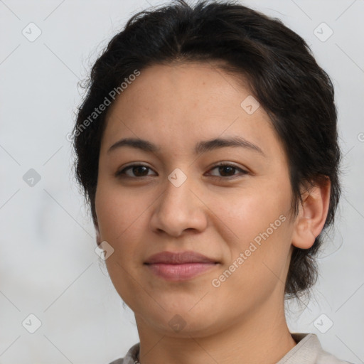 Joyful latino young-adult female with short  brown hair and brown eyes