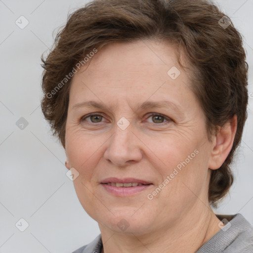 Joyful white adult female with short  brown hair and brown eyes