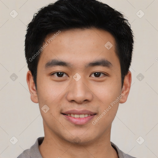 Joyful asian young-adult male with short  black hair and brown eyes