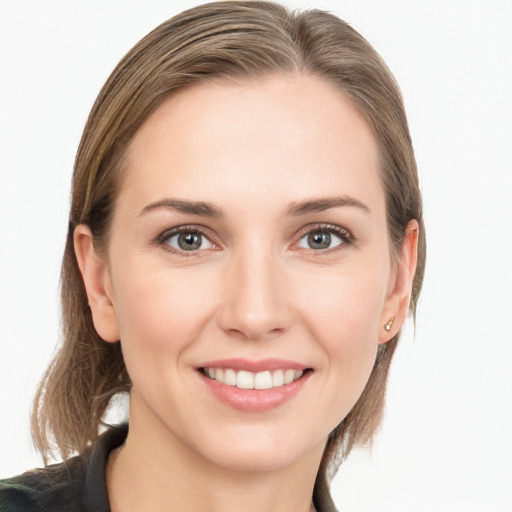 Joyful white young-adult female with long  brown hair and grey eyes