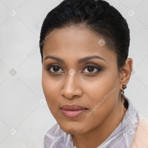 Joyful black young-adult female with short  brown hair and brown eyes