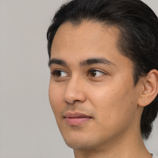 Neutral white young-adult male with medium  black hair and brown eyes