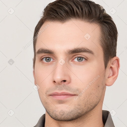 Neutral white young-adult male with short  brown hair and brown eyes