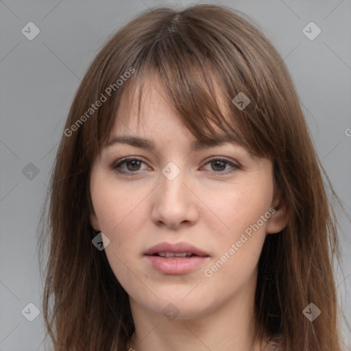 Neutral white young-adult female with long  brown hair and brown eyes