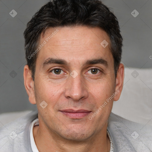 Joyful white adult male with short  brown hair and brown eyes