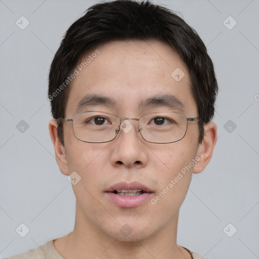 Neutral asian young-adult male with short  brown hair and brown eyes