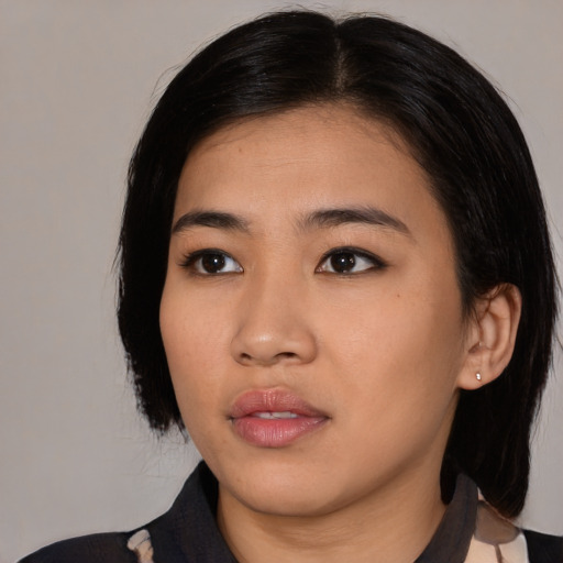 Neutral asian young-adult female with medium  black hair and brown eyes