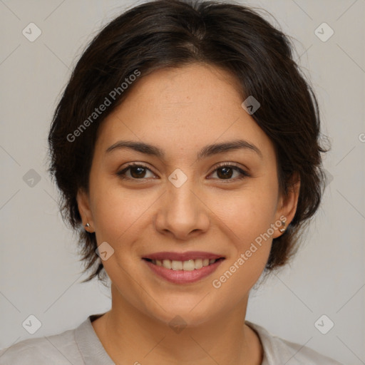 Joyful latino young-adult female with medium  brown hair and brown eyes