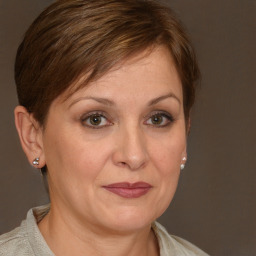 Joyful white adult female with short  brown hair and brown eyes