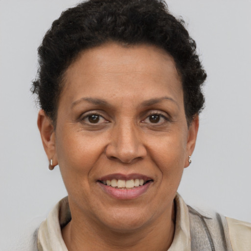 Joyful latino adult female with short  brown hair and brown eyes