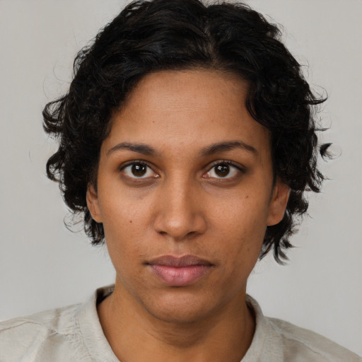 Neutral black young-adult female with short  brown hair and brown eyes