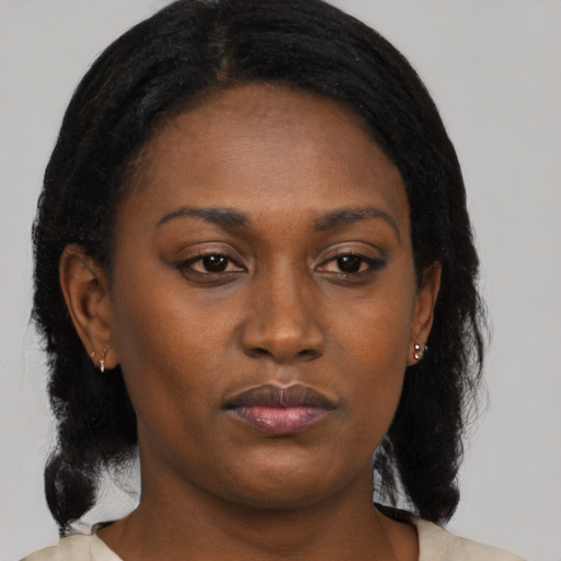 Neutral black young-adult female with medium  black hair and brown eyes