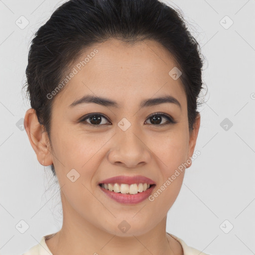 Joyful latino young-adult female with short  brown hair and brown eyes