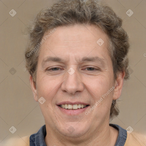 Joyful white adult male with short  brown hair and grey eyes