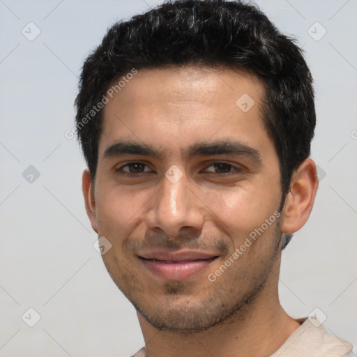 Joyful white young-adult male with short  black hair and brown eyes