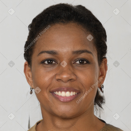 Joyful black young-adult female with short  brown hair and brown eyes