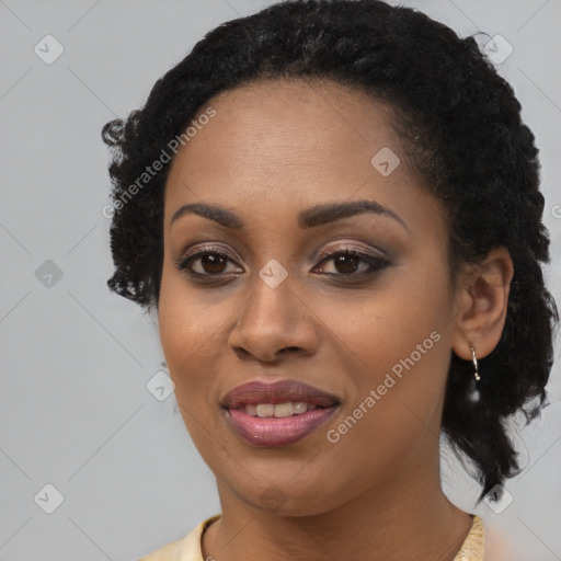 Joyful black young-adult female with medium  brown hair and brown eyes