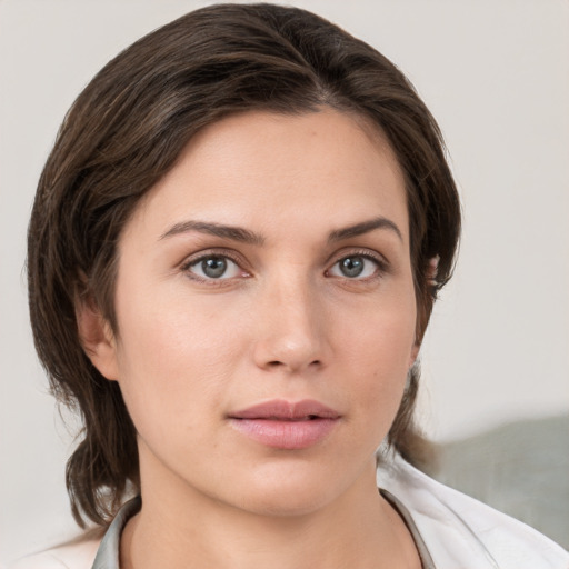 Neutral white young-adult female with medium  brown hair and grey eyes