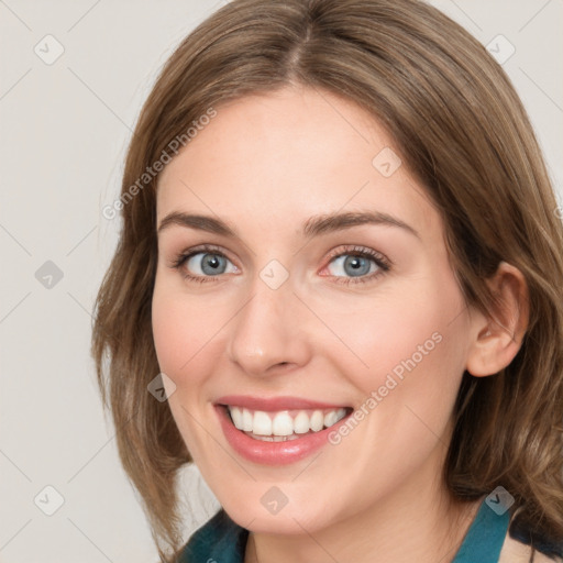 Joyful white young-adult female with medium  brown hair and blue eyes