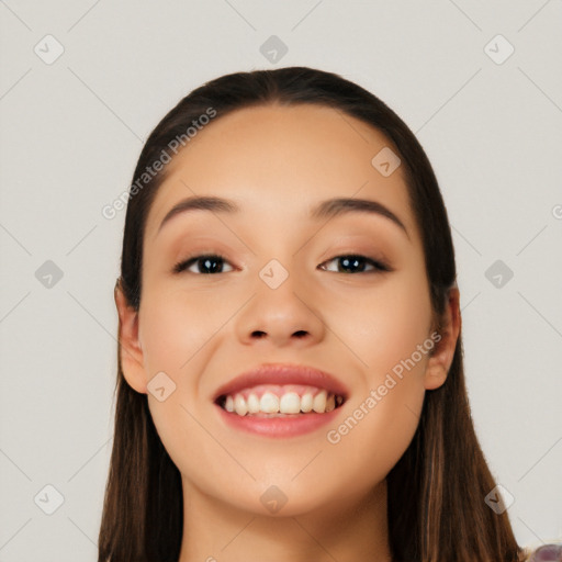 Joyful white young-adult female with long  black hair and brown eyes