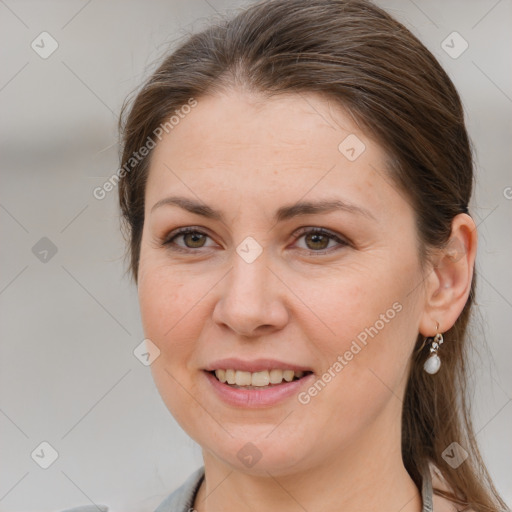 Joyful white adult female with medium  brown hair and grey eyes