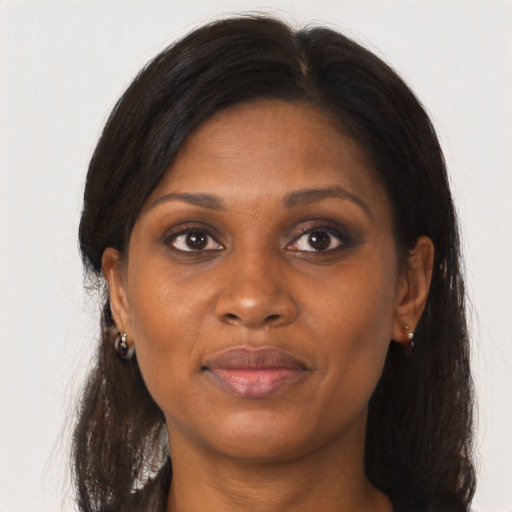 Joyful black young-adult female with medium  brown hair and brown eyes