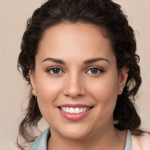 Joyful white young-adult female with medium  brown hair and brown eyes