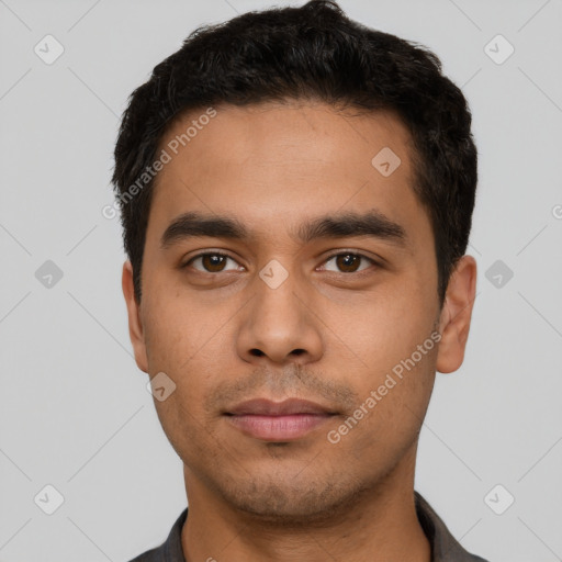 Neutral latino young-adult male with short  black hair and brown eyes