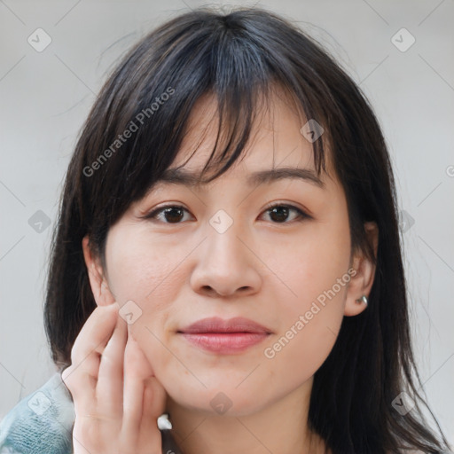 Joyful asian young-adult female with medium  brown hair and brown eyes