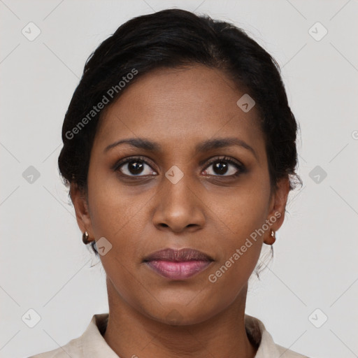 Joyful black young-adult female with short  brown hair and brown eyes