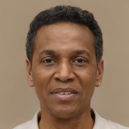 Joyful latino adult male with short  black hair and brown eyes