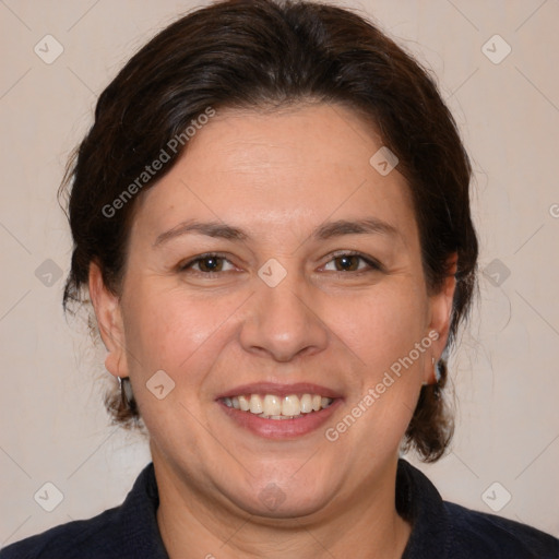 Joyful white adult female with medium  brown hair and brown eyes