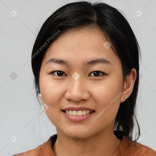 Joyful asian young-adult female with medium  black hair and brown eyes