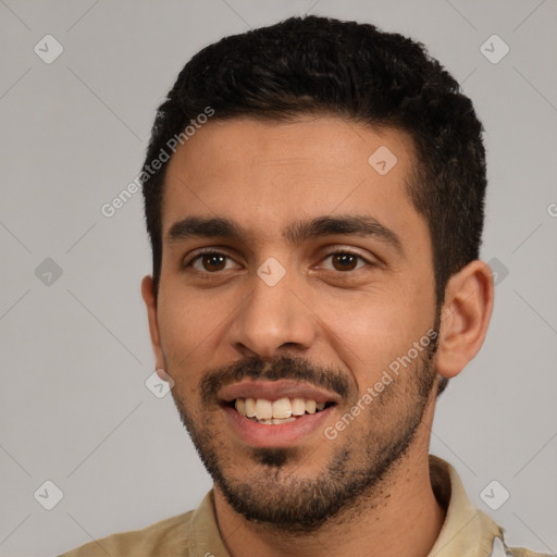 Joyful white young-adult male with short  black hair and brown eyes