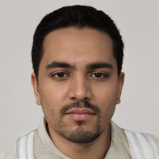 Neutral latino young-adult male with short  black hair and brown eyes