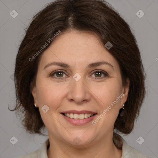 Joyful white adult female with medium  brown hair and brown eyes