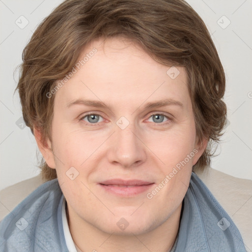 Joyful white young-adult female with medium  brown hair and blue eyes