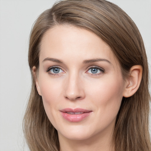 Joyful white young-adult female with long  brown hair and grey eyes