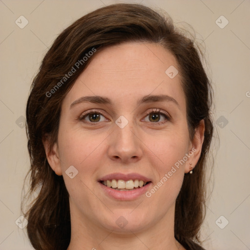 Joyful white young-adult female with medium  brown hair and green eyes