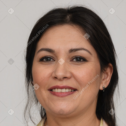 Joyful white adult female with medium  brown hair and brown eyes