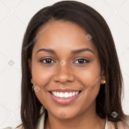 Joyful latino young-adult female with long  brown hair and brown eyes