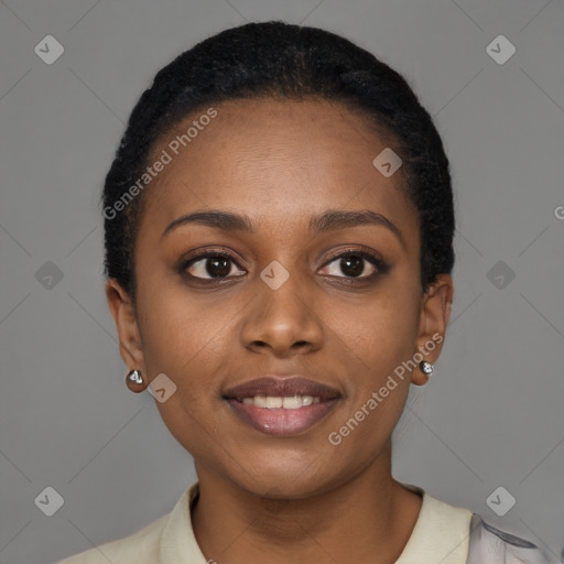 Joyful black young-adult female with short  brown hair and brown eyes