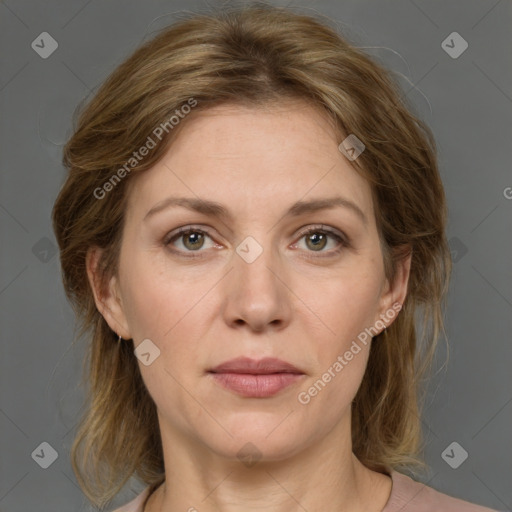 Joyful white adult female with medium  brown hair and grey eyes